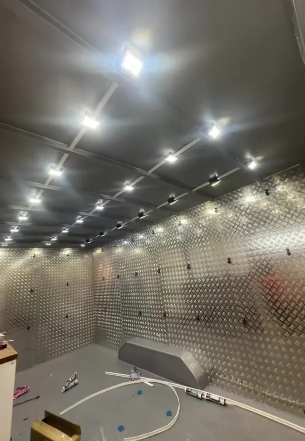 Trailer interior with checker plate walls and rows of LED ceiling lights